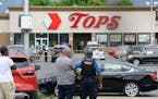 Police on the scene at a Tops Friendly Market Saturday in Buffalo, New York, after 10 people were killed in a mass shooting at the store.