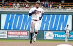 Minnesota Twins' Byron Buxton runs the bases on his solo home run against the Chicago White Sox in the fourth inning of a baseball game Saturday, Apri