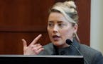 Amber Heard testifies in the courtroom at the Fairfax County Circuit Courthouse in Fairfax, Va., Monday. 