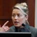 Amber Heard testifies in the courtroom at the Fairfax County Circuit Courthouse in Fairfax, Va., Monday. 