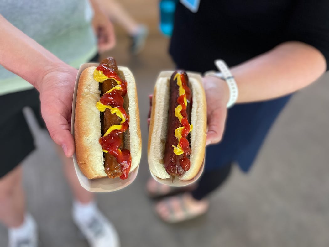 A Sriracha dog from Herbivorious Butcher next to a Kosher all-beef dog.