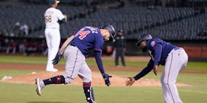 Twins catcher Gary Sanchez was congratulated by third base coach Tommy Watkins after hitting a home run in the sixth inning Monday night.