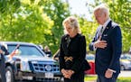President Joe Biden and first lady Jill Biden pay their respects to the victims of Saturday’s shooting at a memorial across the street from the TOPS