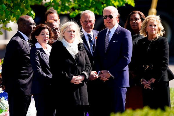 President Joe Biden and first lady Jill Biden meet with officials including, Buffalo Mayor Byron Brown, left, New York Gov. Kathy Hochul, Sen. Kirsten
