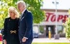 President Joe Biden and first lady Jill Biden pay their respects to the victims of Saturday’s shooting at a memorial across the street from a Tops s