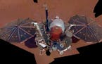 This Dec. 6, 2018 image made available by NASA shows the Insight lander. The scene was assembled from 11 photos taken using its robotic arm. The space