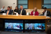 Daron Korte, assistant commissioner of the Minnesota Department of Education, center, shown in April. Others seated with Korte were, from left, Eric T