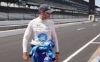 Jimmie Johnson walks down pit lane during practice for the Indianapolis 500 