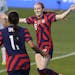 Rose Lavelle, right, of the United States, celebrates a first half goal against Uzbekistan, in a women’s soccer match in Chester, Pa., Tuesday, Apri