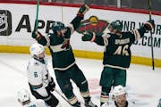 Kevin Fiala, center, and Jared Spurgeon (46) celebrate an overtime game winner in April. 