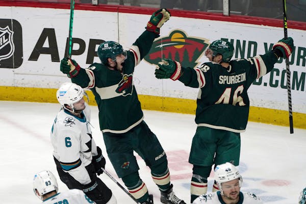 Kevin Fiala, center, and Jared Spurgeon (46) celebrate an overtime game winner in April. 