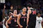 Jalen Suggs (1) celebrated with Chet Holmgren (34) in early 2020 while teammates at Minnehaha Academy.