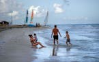 Tourists along the beach at the Iberostar Selection Varadero hotel in Varadero, Cuba, on Sept. 29, 2021.