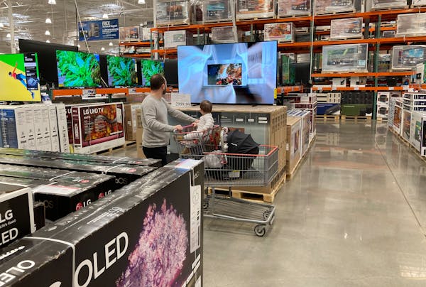 Investors are watching retailers’ latest results for signs that consumers are cutting back due to inflation. File photo of a shopper at a Costco in 
