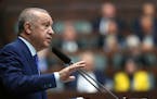 Turkish President Recep Tayyip Erdogan addresses his ruling party legislators, in Ankara, Turkey, Wednesday, May 18, 2022. Erdogan says NATO’s enlar