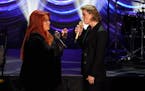 Wynonna Judd, left, and Brandi Carlile perform during a tribute to country music star Naomi Judd Sunday, May 15, 2022, in Nashville, Tenn. Judd died A