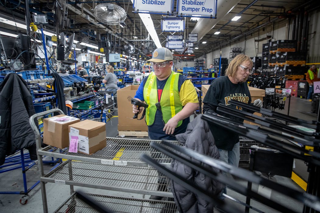 Workers during a shift at the Polaris manufacturing plant in Roseau, Minn.