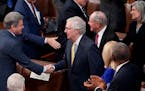 House Foreign Affairs Committee Ranking Member Michael McCaul, R-Texas, left, reaches out to greet Senate Minority Leader Mitch McConnell, R-Ky., cent