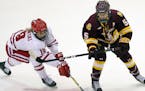 Minnesota Duluth’s Sidney Morin, right, battled Wisconsin’s Annie Pankowski for the puck during the 2016 WCHA title game.