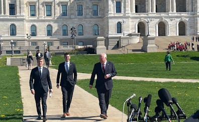 From left, DFL House Majority Leader Ryan Winkler, Republican Senate Majority Leader Jeremy Miller and DFL Gov. Tim Walz walk to meet reporters in fro