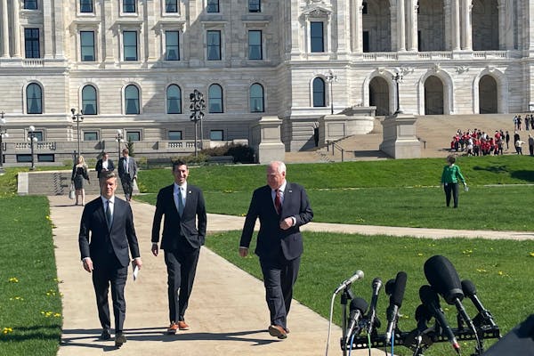 From left, DFL House Majority Leader Ryan Winkler, Republican Senate Majority Leader Jeremy Miller and DFL Gov. Tim Walz walk to meet reporters in fro