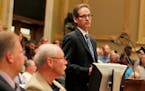 Deputy City Attorney Peter Ginder addressed crowded controversial hearings in Minneapolis City Council chambers on whether the city should take form i
