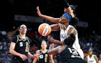 Lynx center Sylvia Fowles fights for a rebound between Las Vegas forward A’ja Wilson and guard Chelsea Gray during Thursday’s game