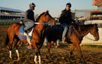 Preakness entrant Epicenter, left, the runner up in the Kentucky Derby horse race, leaves the track after a workout earlier this week.