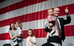 GOP attorney general candidate Jim Schultz left the stage with his wife, Molly, and their children during this month’s state Republican convention i