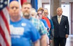 Gov. Tim Walz waits to walk into the convention hall with the color guard during the DFL state convention in Rochester.
