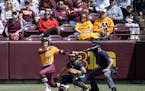 Gophers center fielder Natalie DenHartog, above in a game a year ago, had two hits against Texas A&M on Friday, but Minnesota lost 5-1 in an NCAA tour