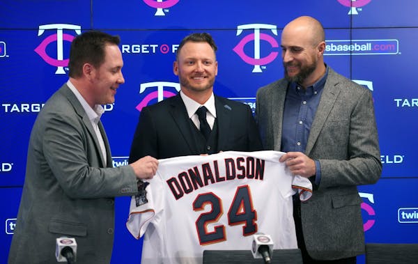 Twins boss Derek Falvey, left, decided to offer a record-setting contract to third baseman Josh Donaldson two years ago, only to deal the veteran slug