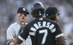 Ex-Twins third baseman Josh Donaldson, left, and Chicago White Sox baserunner Tim Anderson (7) exchange words in the first inning of a game between th
