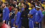 Dallas Mavericks players watch from the bench area during the second half of Game 2 