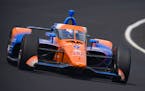Scott Dixon drives through the first turn during qualifications for the Indianapolis 500 