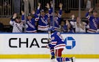 New York Rangers’ Mika Zibanejad reacts after scoring a goal against the Hurricanes in the first period of Game 3