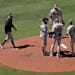 Twins manager Rocco Baldelli, left, walked to the mound to make a pitching change during the sixth inning Sunday, removing rookie Yennier Cano to brin