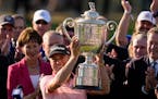 Justin Thomas holds the Wanamaker Trophy after winning the PGA Championship in a playoff against Will Zalatoris at Southern Hills in Tulsa