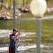 Daniel Belous cast into the Rum River from the dam in Anoka in May 2020. The warning buoys that are typically upstream from the Rum River dam in Anoka