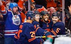 Oilers winger Evander Kane, second right, celebrates his goal with teammates during the second period 
