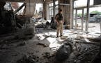 A Ukrainian officer in a factory destroyed by an airstrike in Slovyansk, in the Donbas region, May 13, 2022. Russia has pressed ahead with its assault