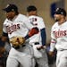 From left, Minnesota Twins second baseman Jorge Polanco (11), designated hitter Byron Buxton (25) and shortstop Royce Lewis (23) celebrate their team�