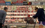Consumers shop for meat at a Safeway grocery store in Annapolis, Md.