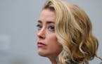 Actor Amber Heard listens in the courtroom at the Fairfax County Circuit Courthouse in Fairfax, Va., Monday, May 23, 2022. Actor Johnny Depp sued Hear