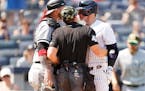 Umpire Nick Mahrley attempts to separate Chicago White Sox catcher Yasmani Grandal, left, and the New York Yankees’ Josh Donaldson during the fifth 