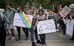 Amnet Ramos, 44, and her daughter, Inaia Hernandez, 12, stand for a portrait during a protest in Manhattan on Saturday, May 14, 2022, in New York wher