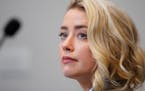 Amber Heard listens in the courtroom at the Fairfax County Circuit Courthouse in Fairfax, Va., Monday, May 23, 2022. 