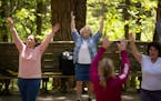 Denise Gagner, Chloe Akina, and Franca Lipari, from left, took part in Zumba dance class in the forest led by Hayley Kilbride-Pierce, foreground for t