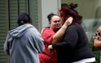 People react edoutside the Civic Center in Uvalde, Texas on Tuesday after an 18-year-old gunman opened fire at an elementary school in the town 85 mil