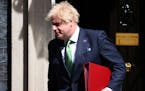 Britain’s Prime Minister Boris Johnson leaves 10 Downing Street in London on May 18, 2022, to take part in the weekly session of Prime Minister’s 